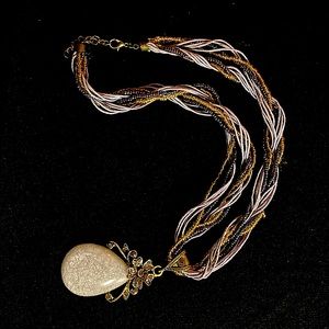 Lovely tiny beaded and twisted cloth necklace with jeweled stone pendant
